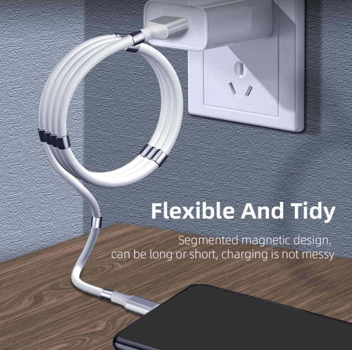 Flexible magnetic charging cable with a smartphone on a wooden surface, plugged into an outlet.
